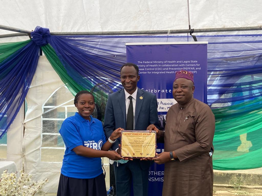 U.S. CDC Country Director Dr. Mary Adetinuke Boyd presents Lifetime Achievement Award to...