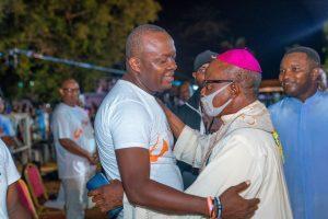 Valentine Ozigbo embracing the Archbishop of Onitsha Archdiocese, His Grace Most Rev. Valerian Okeke