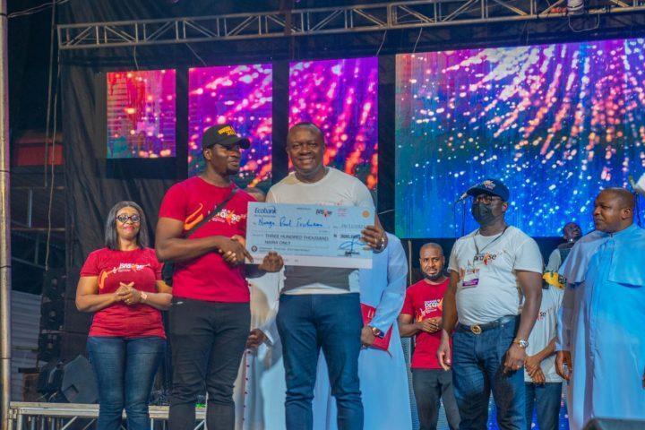 Valentine Ozigbo, offering cash award to winners of he 2021 Unusual Entrepreneurs during the Unusual Praise Event at the Basilica of the Most Holy Trinity, Onitsha