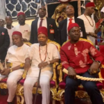 Prince Arthur Eze (centre) and Governor Soludo in red Isiagu (traditional dress for high chiefs) holding the Odu Mkpa-alo (horn made of elephant tusk) at the last Ofala Festival in Dunukofia