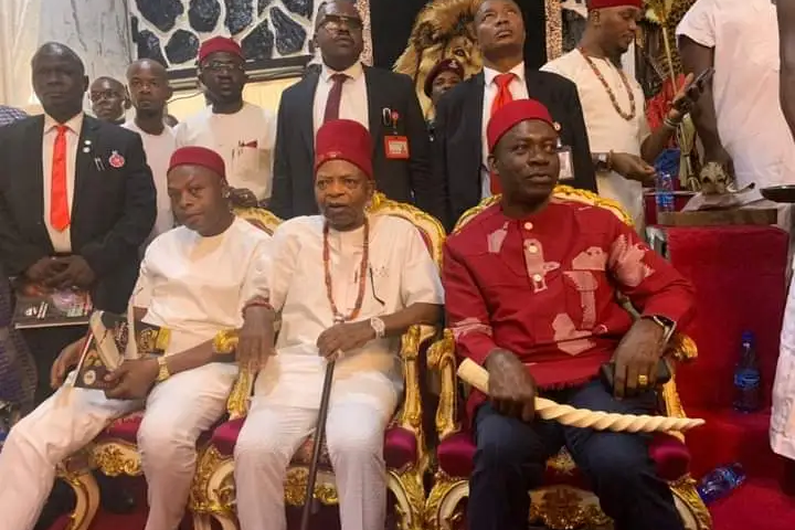 Prince Arthur Eze (centre) and Governor Soludo in red Isiagu (traditional dress for high chiefs) holding the Odu Mkpa-alo (horn made of elephant tusk) at the last Ofala Festival in Dunukofia