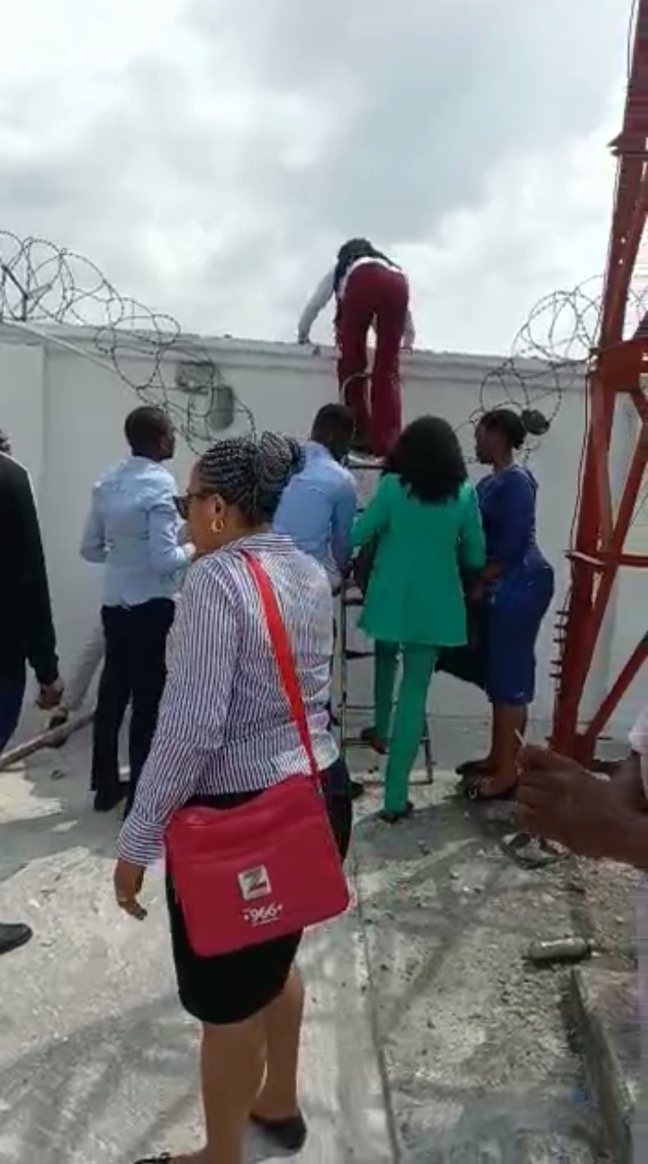 Naira Scarcity: Bankers In Viral Video Flee Angry Customers Through Back Fence