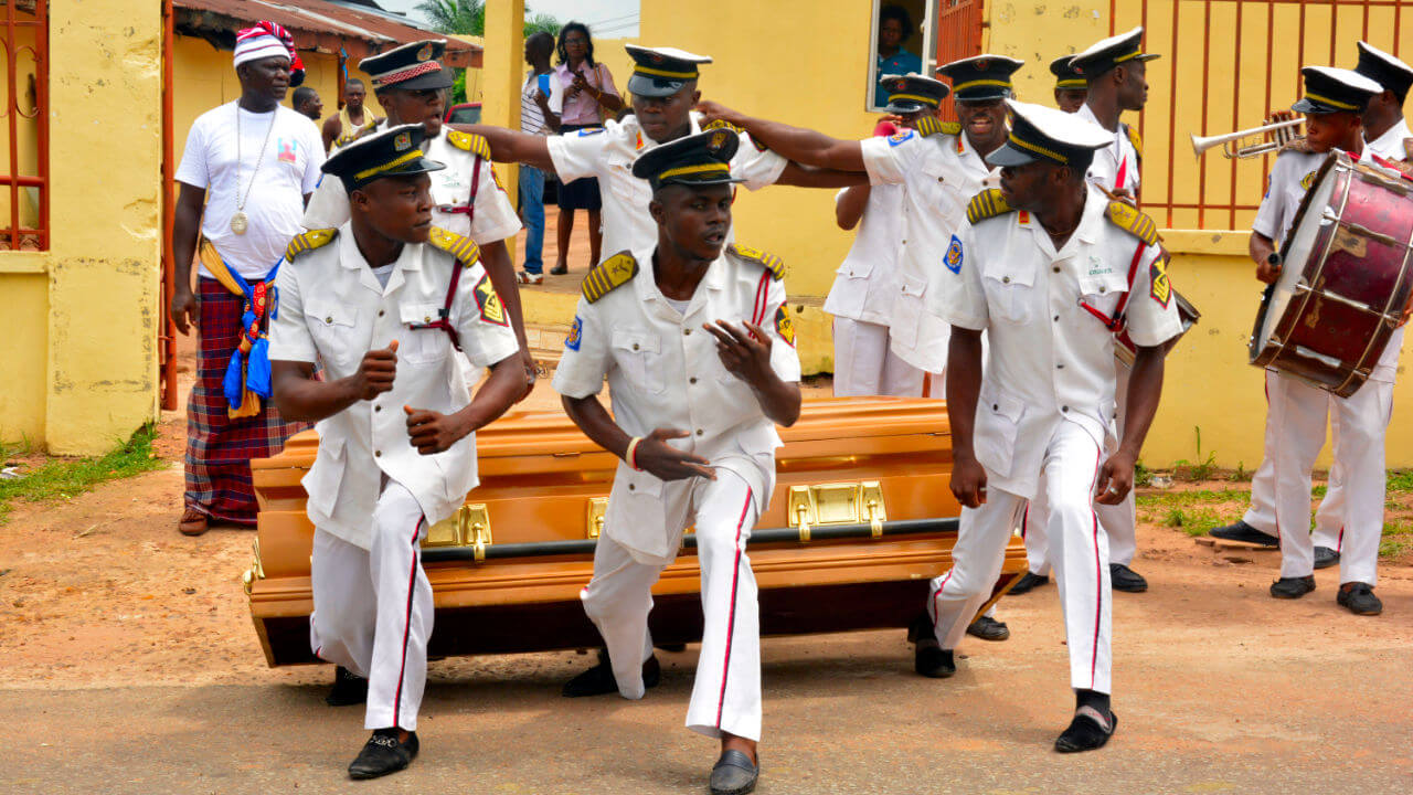 Undertakers dancing with casket on their way to the burial site Abiriba Abia State nigeria