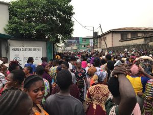 PHOTOS: Fight As Nigerians Scramble For Customs Rice In Yaba