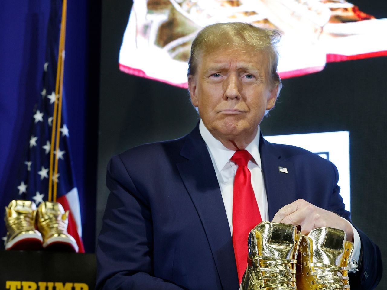 Trump Booed As He Sells Gold Sneakers At Philadelphia Convention