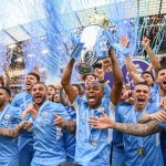 Manchester City Football Club team celebrates with Premier League trophy championship May ()