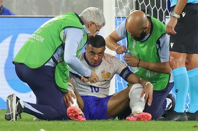 kylian mbappe being attended to at the euro championship