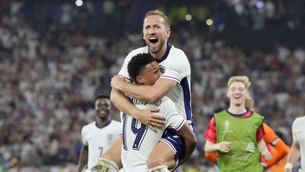 England Captain Harry kane celebrates with goal scorer Olie Watkins