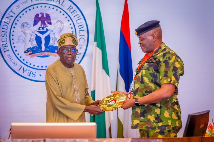 Tinubu with National Defence College official