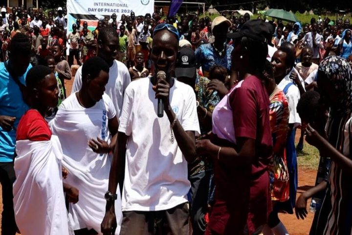 Tambura residents walk and dance their way to Peace Day celebrations