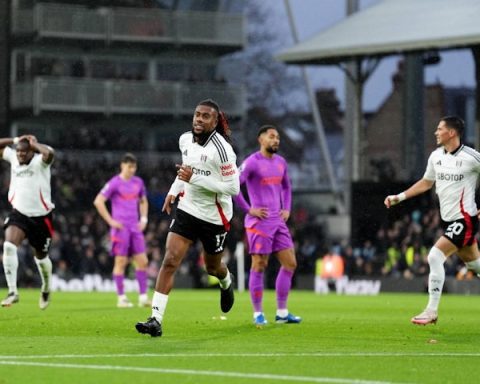 Fulham's Alex Iwobi reacts after scoring opening goal