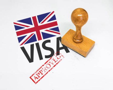 United Kingdom Visa Approved with Rubber Stamp and flag