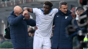 Fisayo Dele Bashiru being helped out by club officials after injury