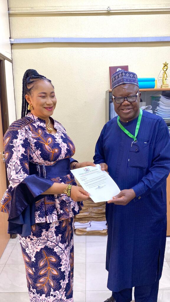 Oko Poly Rector Awuzie receiving certificate of appointment