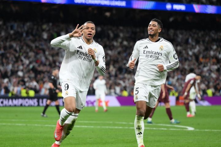 Real Madrid forward and hat trick hero Kylian Mbappe celebrates Bellingham