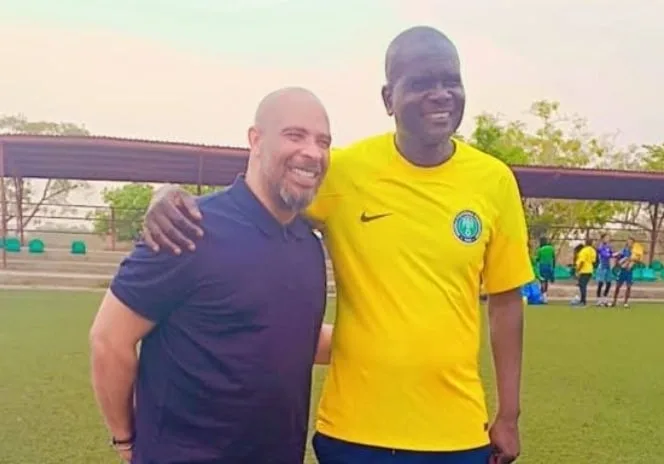 Super EAgles Coach Eric Chelle and Flying Eagles handler Aliyu Zubairu